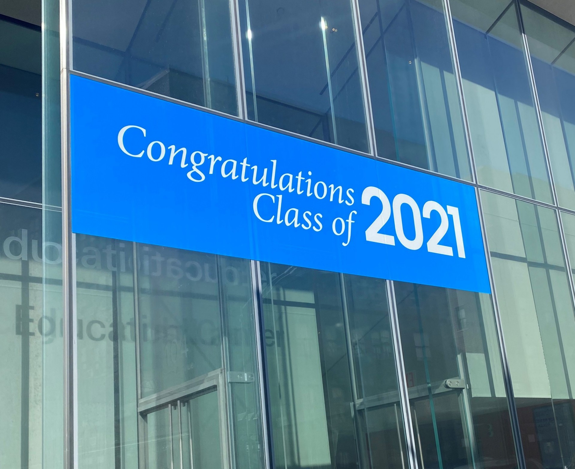 "Congratulations Class of 2021" graphic on a building window