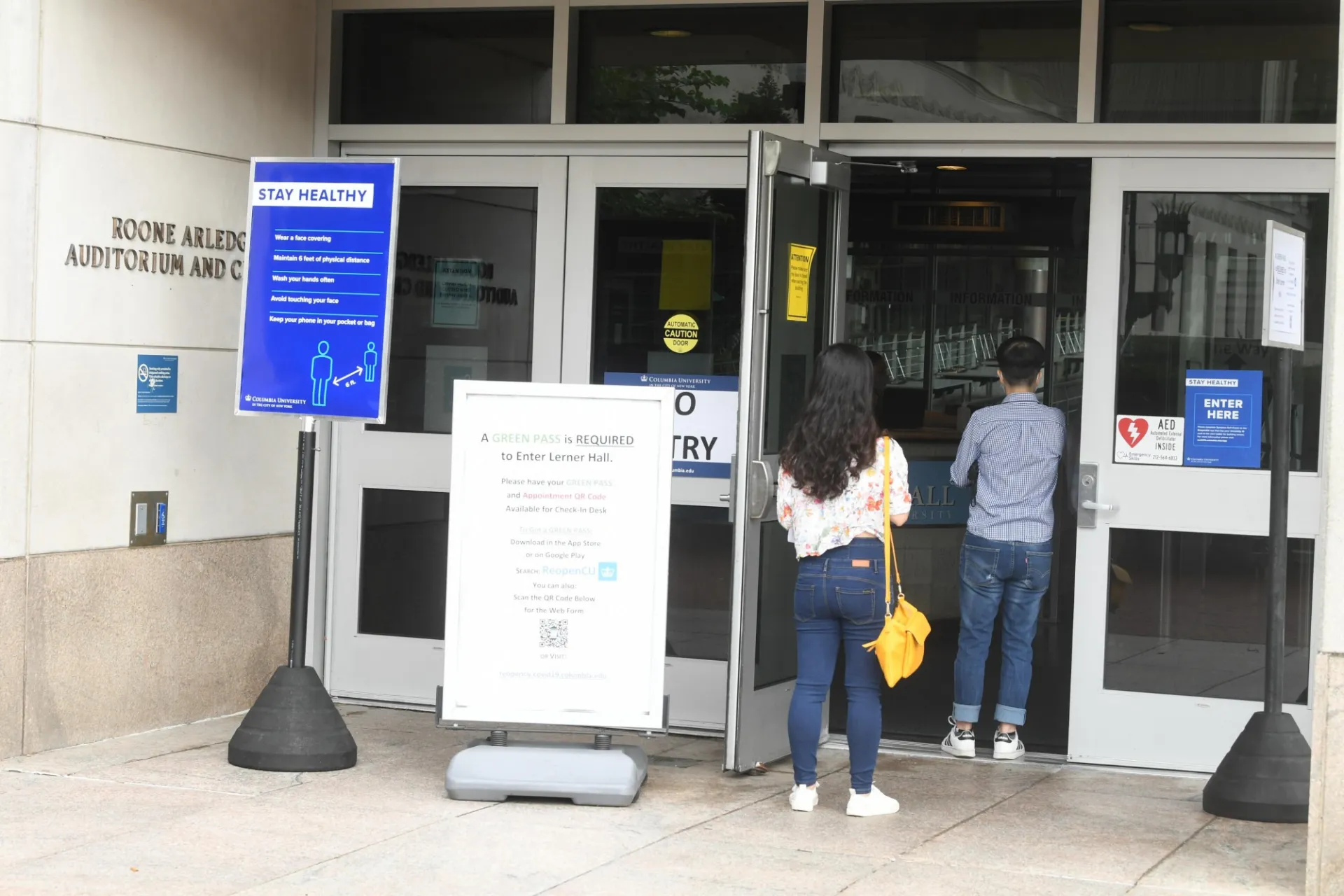 Lerner Hall doors with Stay Healthy signage
