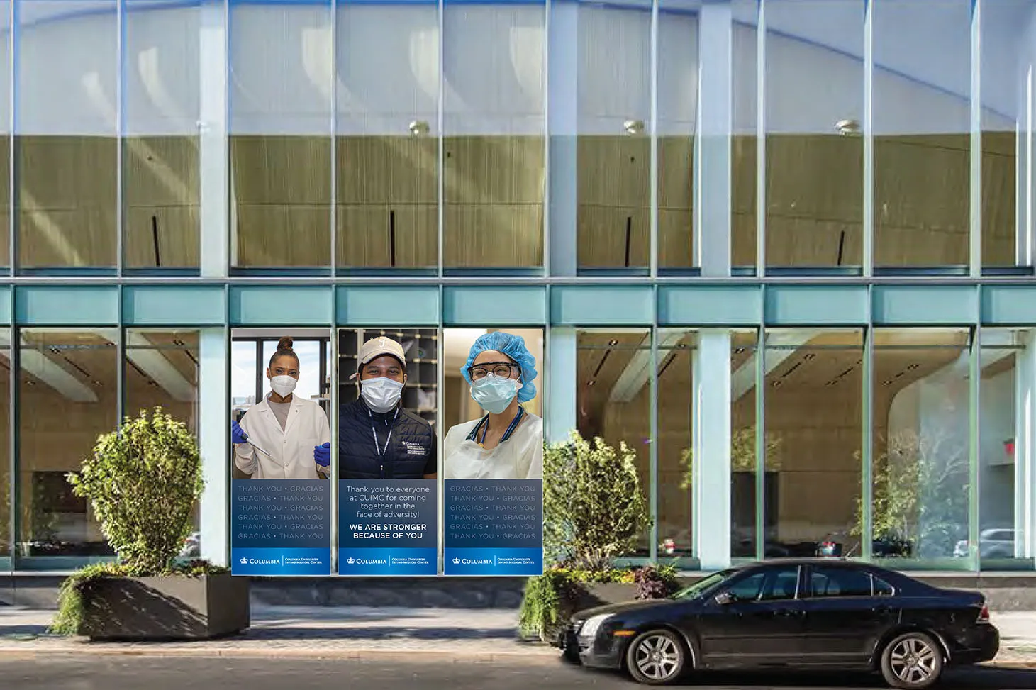 A banner thanking essential medical personnel at CUIMC and NY-Presbyterian for their work in the COVID-19 pandemic. Three medical workers pose for photos wearing protective masks and gloves. Beneath their photos the words "We are stronger because of you" and the Columbia logo are displayed.