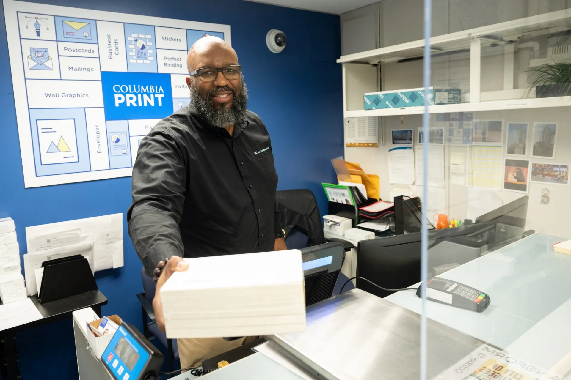 Columbia Print staff working in the print shop