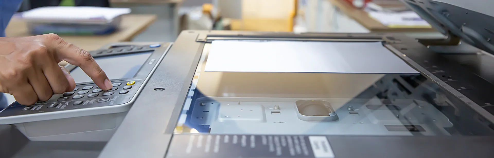 Person using a copier in an office